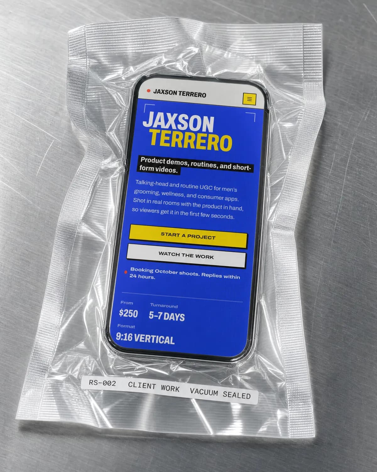 Jaxson Terrero's UGC portfolio on a phone, vacuum sealed on brushed steel
